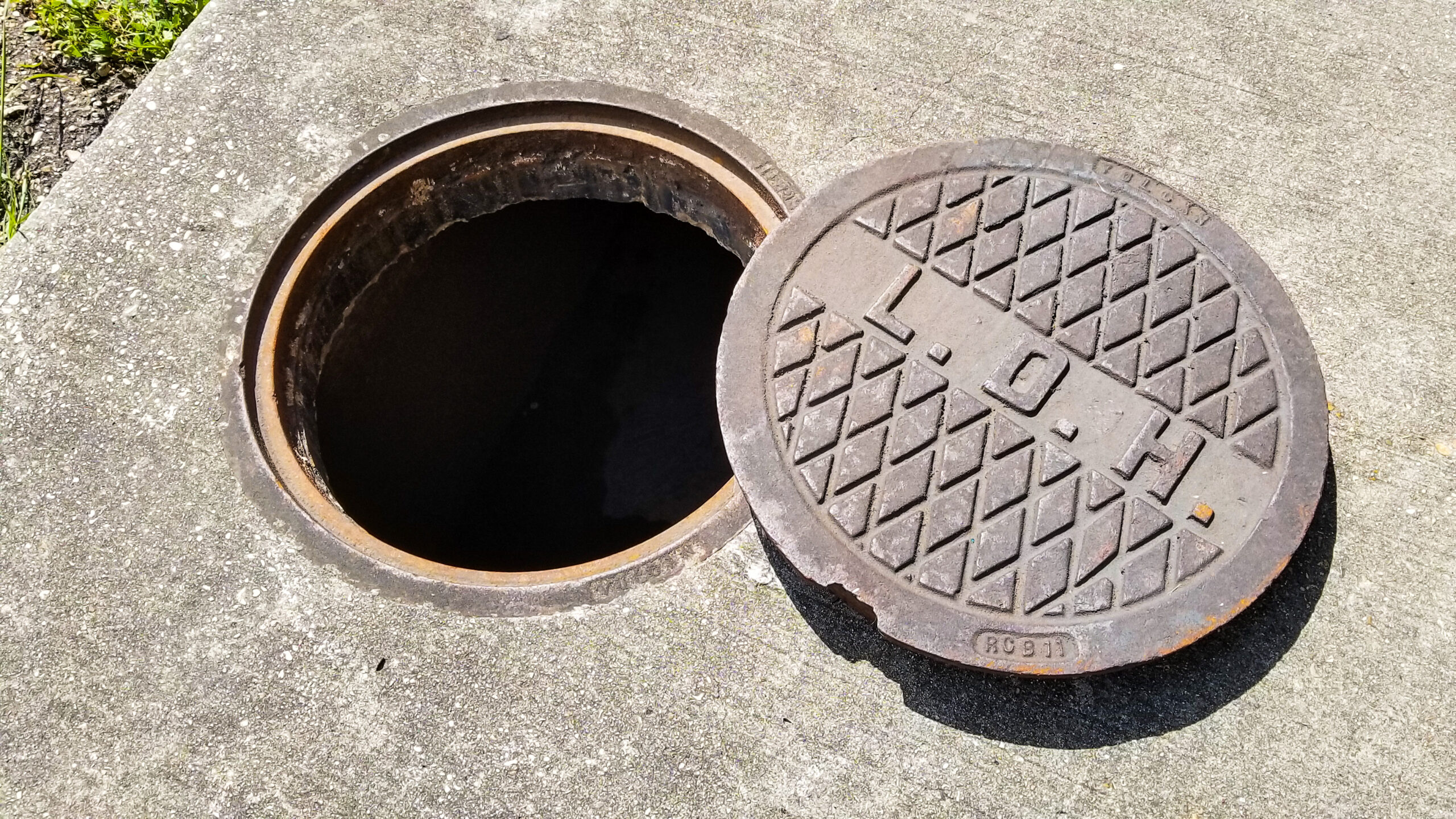 Open Manhole and Cover Mid City New Orleans scaled